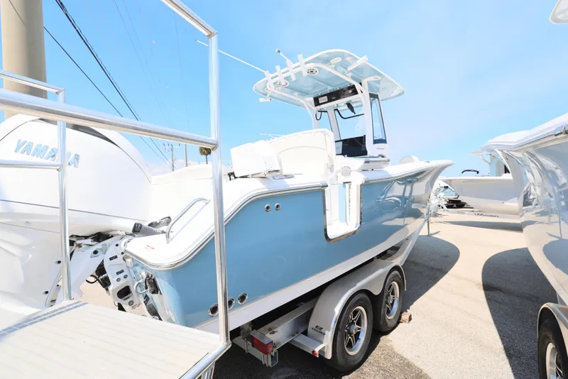 Slide: The Image of 2025 Sea Hunt Ultra 265 SE boat on trailer, side view, sunny day. - 10