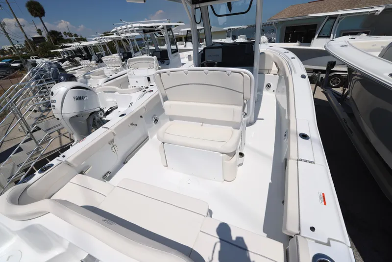 Slide: The Image of 2025 Sea Hunt Ultra 265 SE boat interior with seating and Yamaha engine. - 20