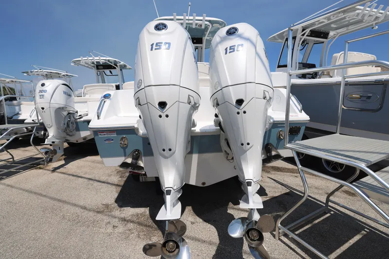 Slide: The Image of 2025 Sea Hunt Ultra 265 SE with dual 150 horsepower outboard engines. - 4
