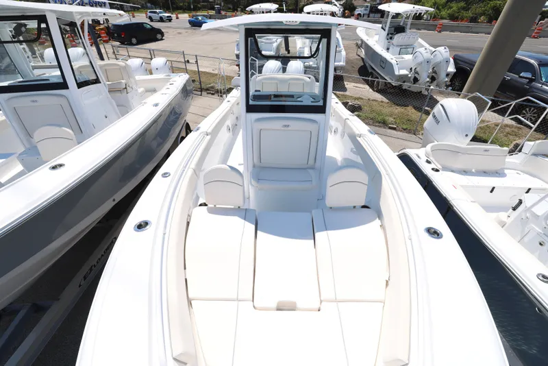 Slide: The Image of 2025 Sea Hunt Ultra 265 SE boat with spacious seating and sleek design. - 5
