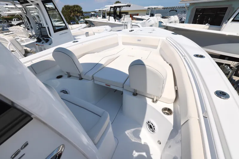 Slide: The Image of 2025 Sea Hunt Ultra 265 SE boat interior with white seating and modern design. - 7