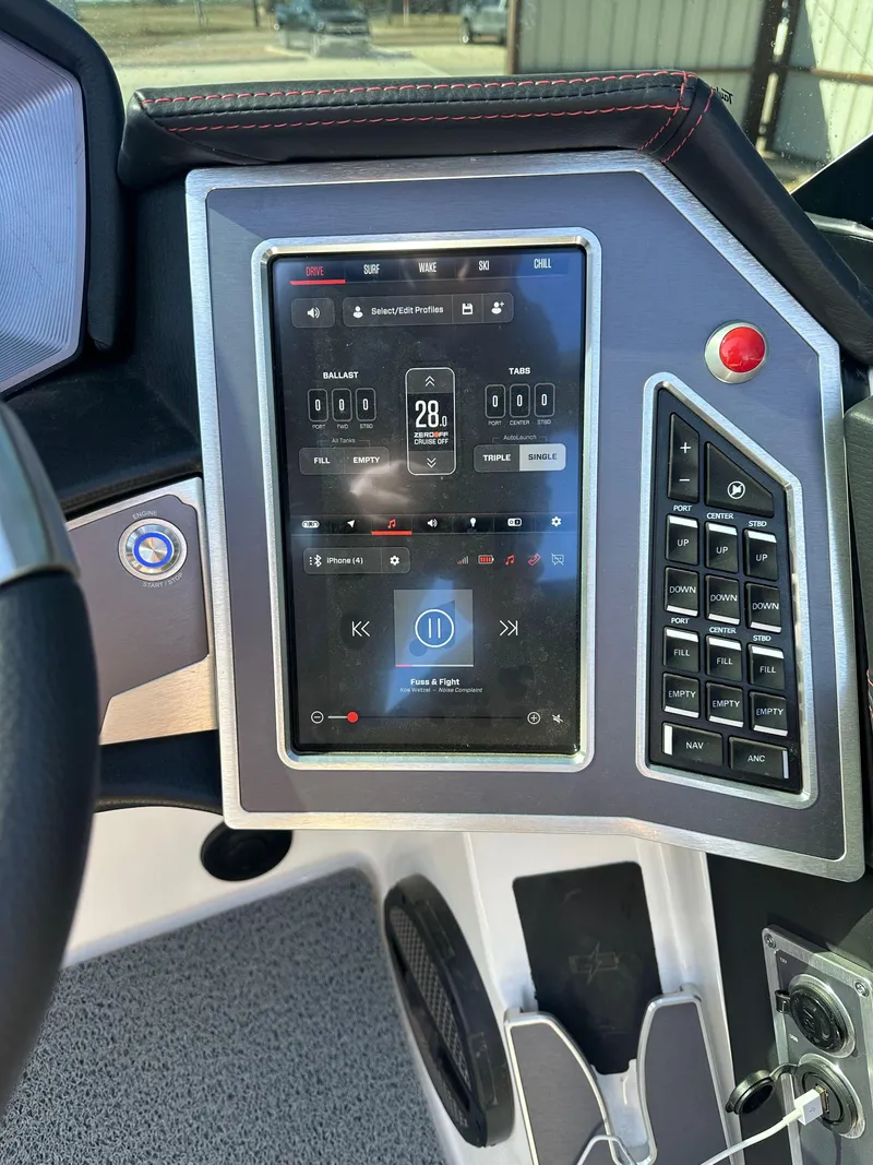 Slide: The Image of 2023 MasterCraft X26 boat dashboard with touchscreen controls and navigation display. - 6