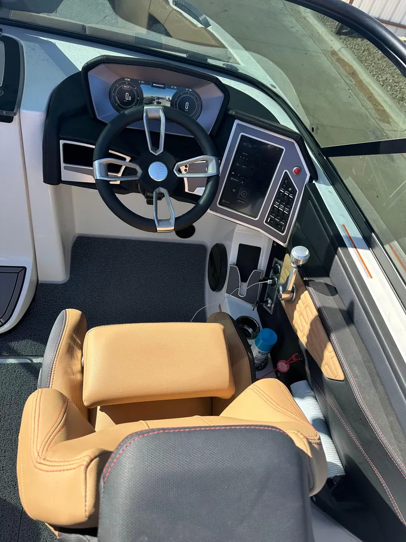 Slide: The Image of 2023 MasterCraft X26 boat cockpit with modern steering and controls. - 7