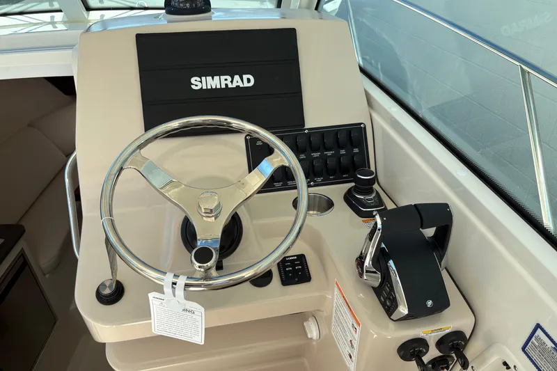 Slide: The Image of Helm of 2026 Boston Whaler 285 Conquest with Simrad electronics and controls. - 11
