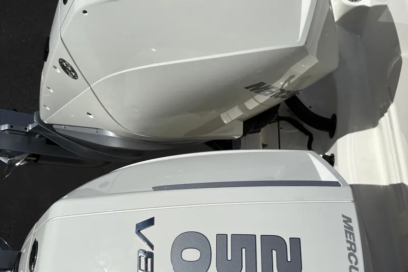 Slide: The Image of Twin Mercury outboard engines on a 2026 Boston Whaler 285 Conquest boat. - 6