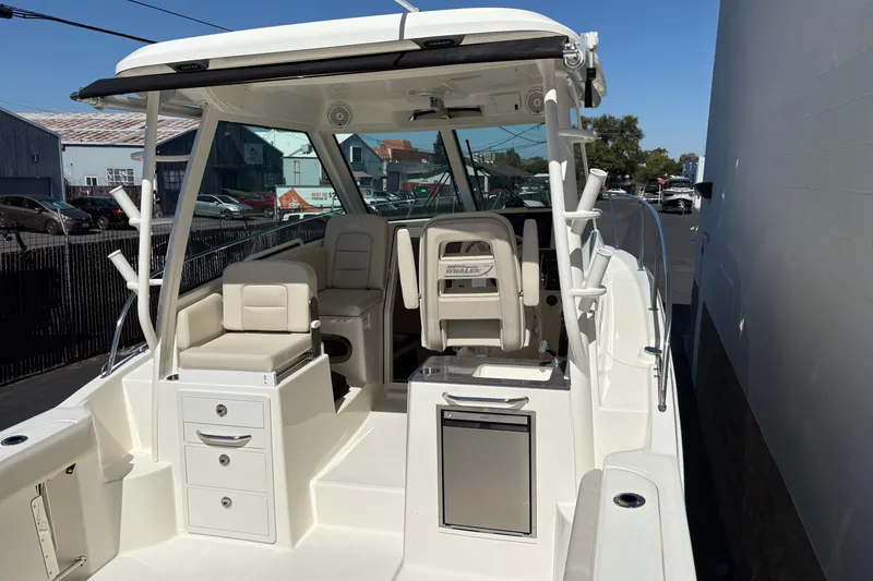 Slide: The Image of 2026 Boston Whaler 285 Conquest boat interior with seating and storage compartments. - 8