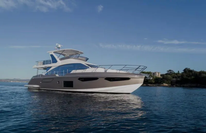 The Image of 2023 Azimut Fly 60 yacht cruising on calm blue waters. - 1