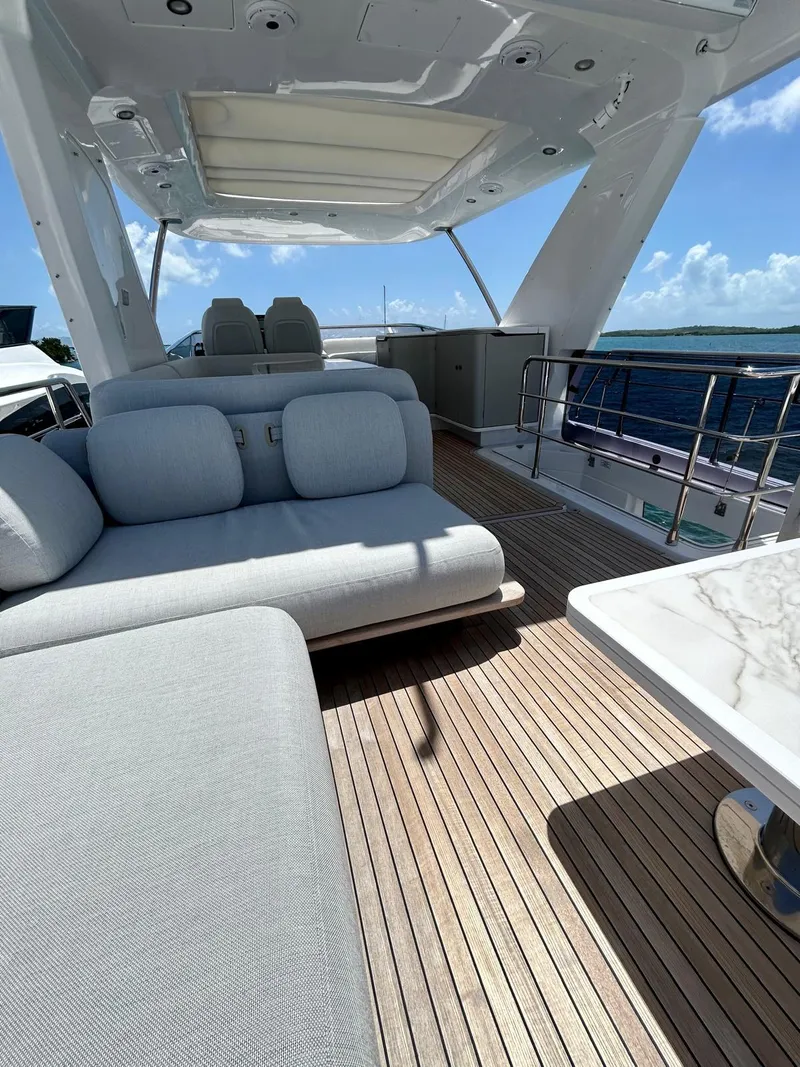Slide: The Image of Luxurious 2023 Azimut Fly 60 yacht deck with elegant seating and ocean view. - 10