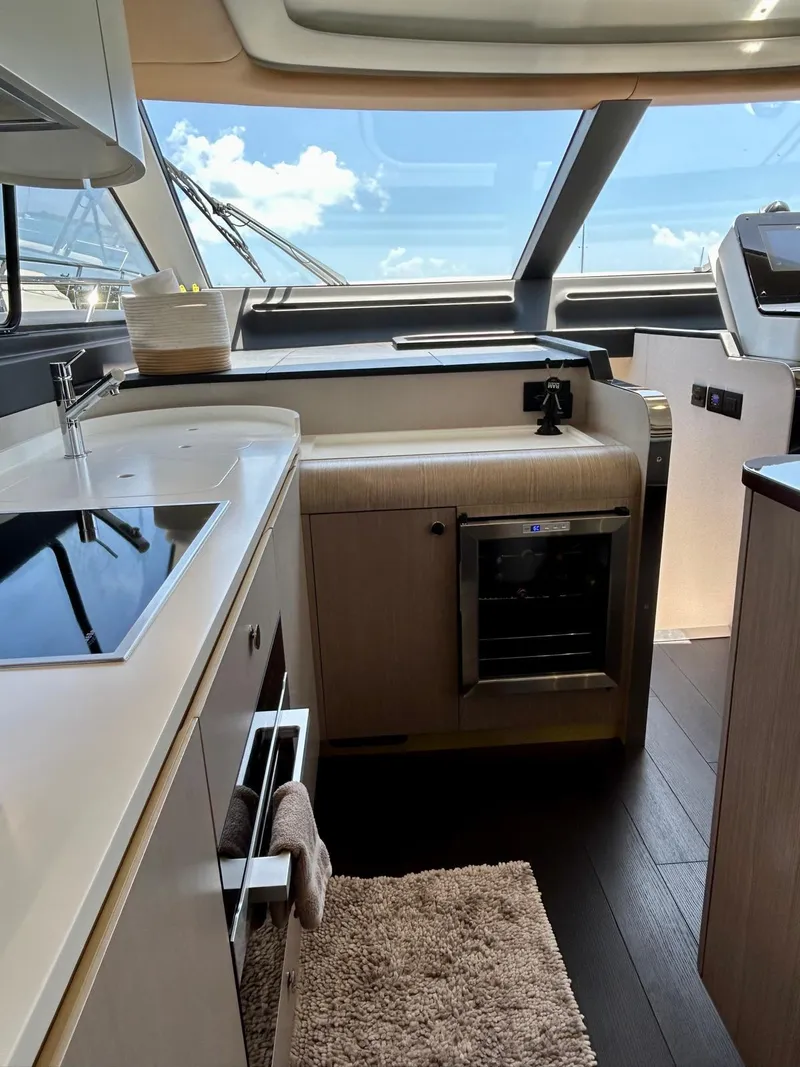 Slide: The Image of Luxurious interior of 2023 Azimut Fly 60 yacht with modern kitchen amenities. - 13
