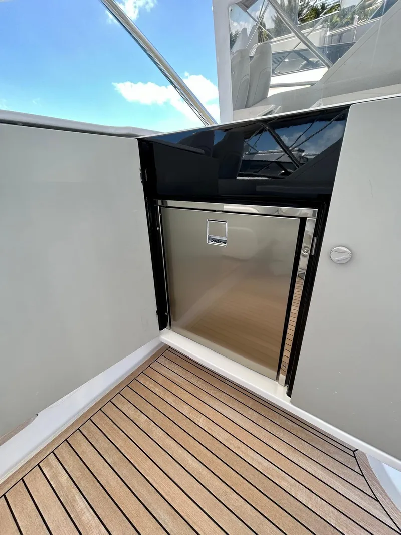 Slide: The Image of 2023 Azimut Fly 60 yacht with sleek stainless steel door and teak flooring. - 15
