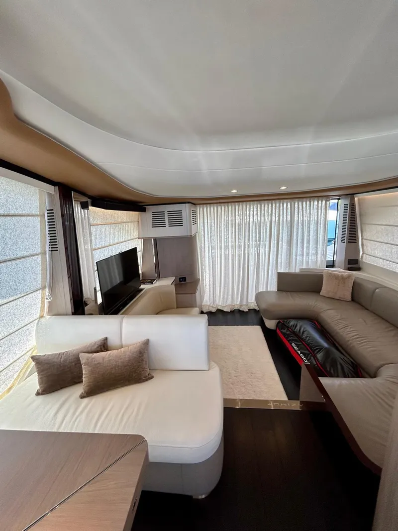 Slide: The Image of Luxurious interior of 2023 Azimut Fly 60 yacht with modern seating and elegant decor. - 19