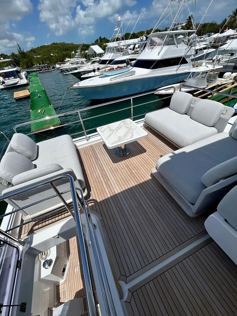 Slide: The Image of Luxurious 2023 Azimut Fly 60 yacht with spacious deck and elegant seating at marina. - 21