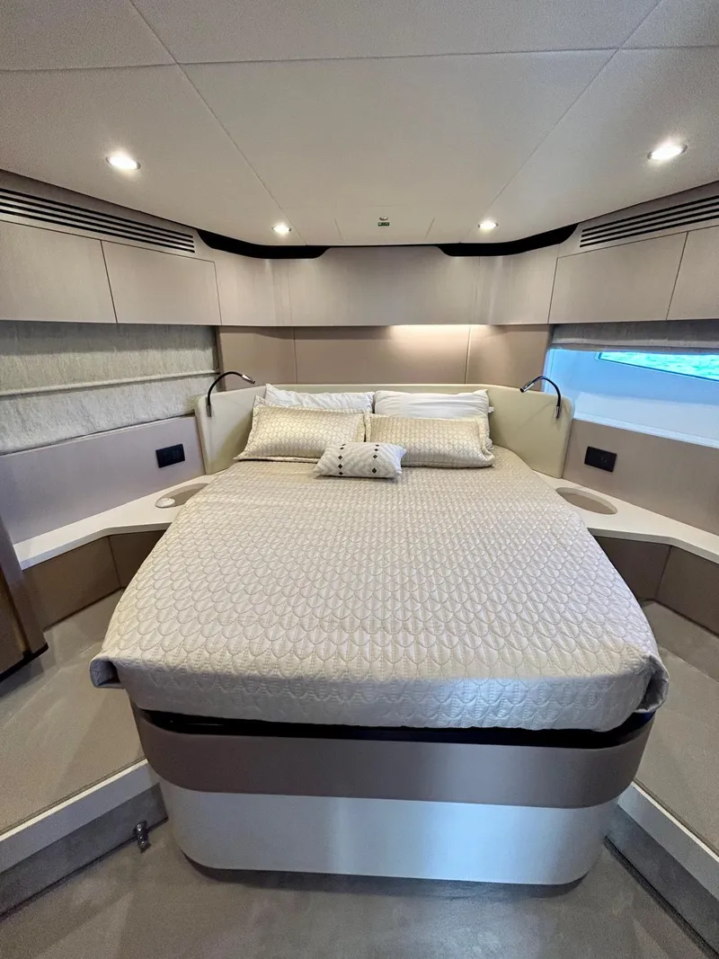 Slide: The Image of Luxurious bedroom interior of 2023 Azimut Fly 60 yacht with modern design and cozy bedding. - 23