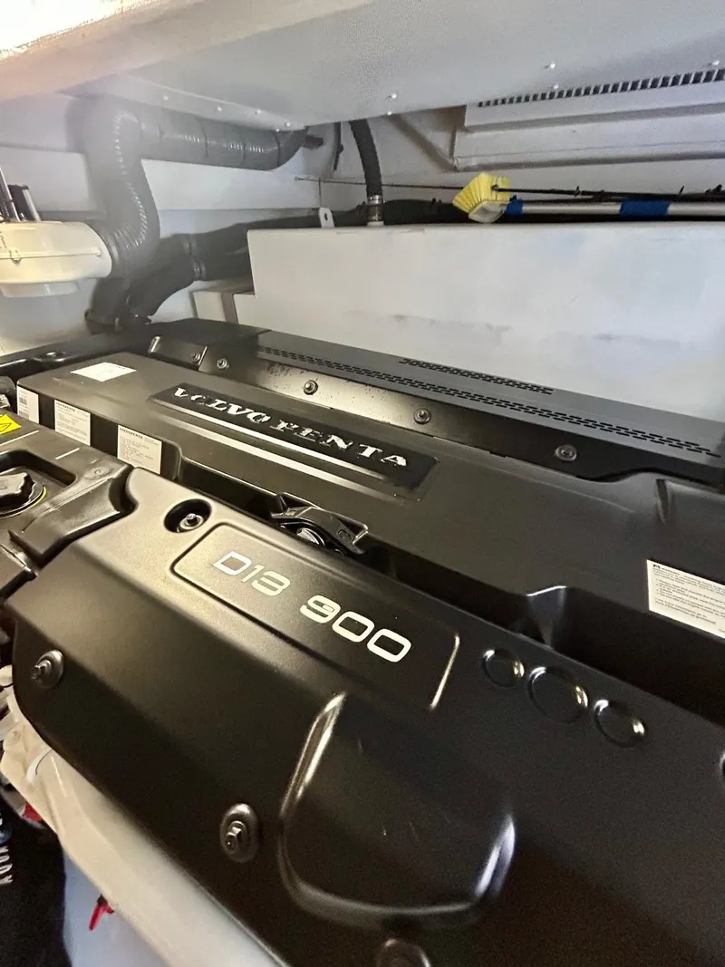 Slide: The Image of 2023 Azimut Fly 60 engine room featuring a powerful D13 900 engine. - 28