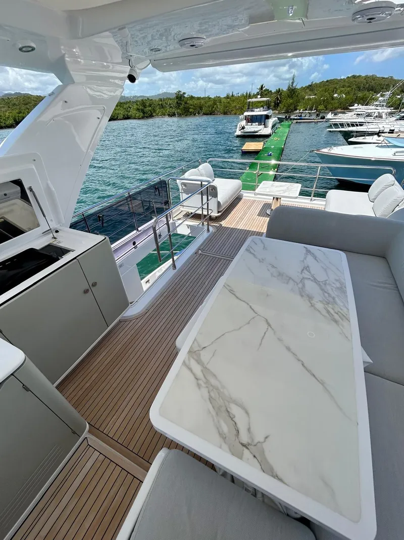 Slide: The Image of Azimut Fly 60 yacht deck with elegant seating and marble table, 2023 model. - 35