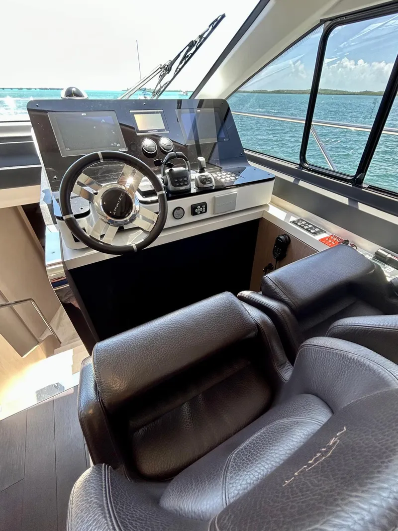 Slide: The Image of 2023 Azimut Fly 60 yacht helm with modern controls and ocean view. - 36