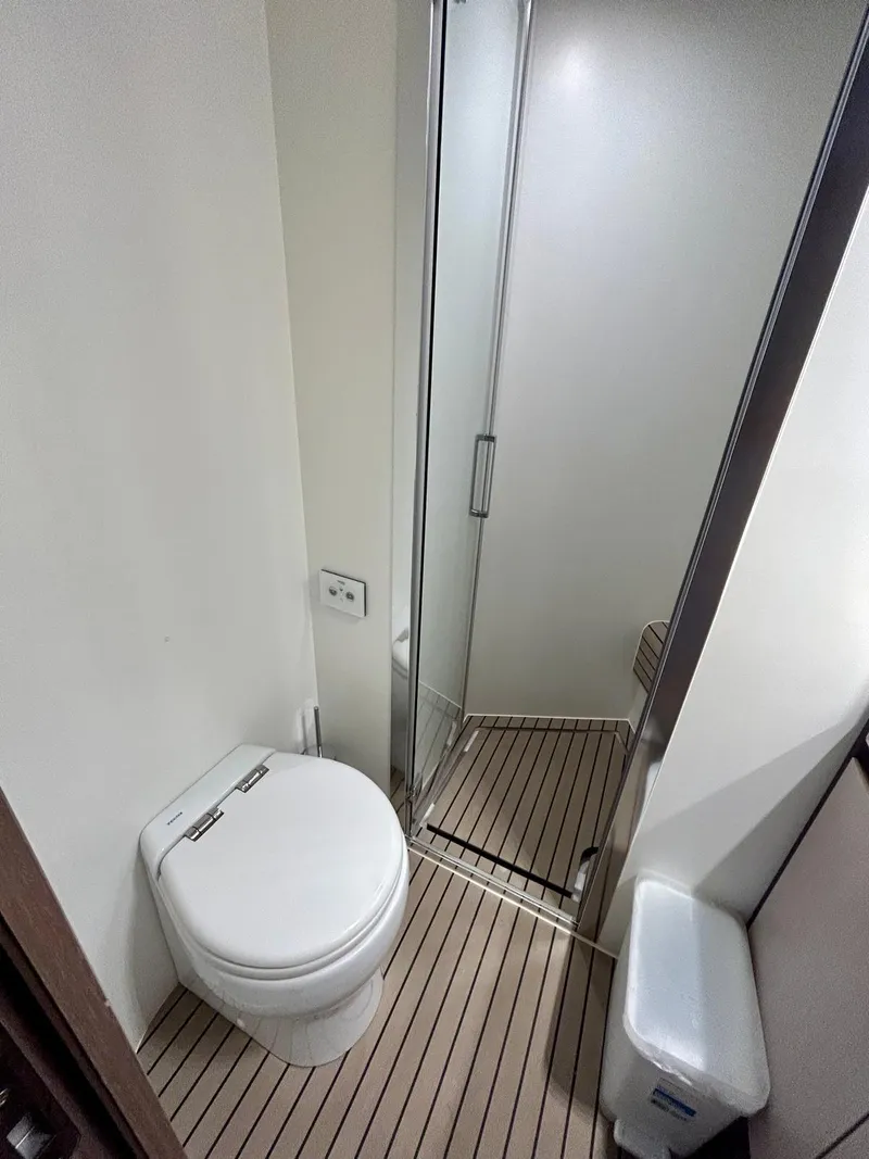 Slide: The Image of 2023 Azimut Fly 60 yacht bathroom with modern toilet and shower. - 38