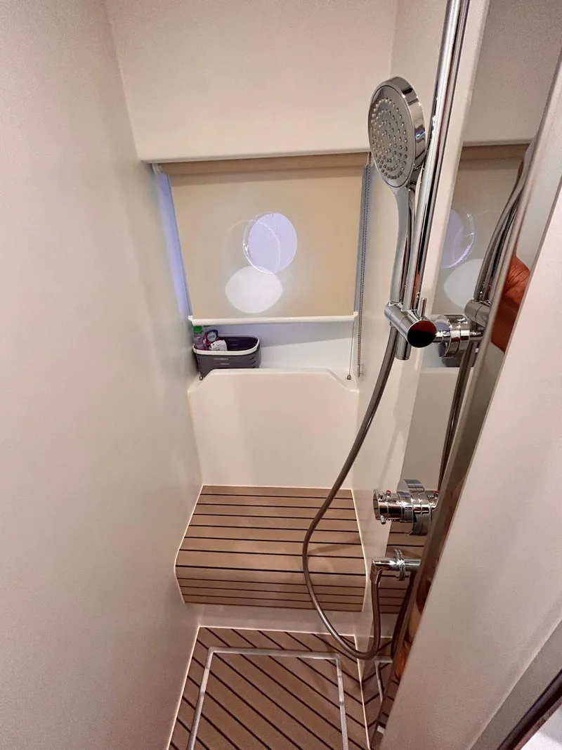 Slide: The Image of 2023 Azimut Fly 60 yacht shower with modern fixtures and wooden flooring. - 5