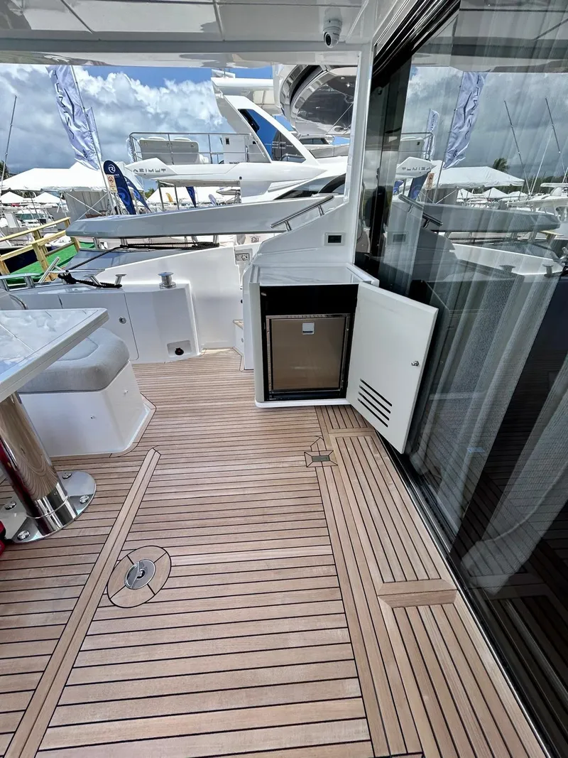 Slide: The Image of 2023 Azimut Fly 60 yacht deck with sleek design and modern amenities. - 9