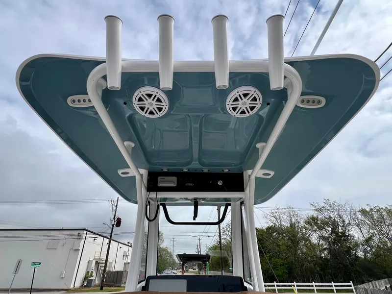 Slide: The Image of 2025 Sea Hunt Ultra 235SE boat top view with rod holders and speakers. - 11