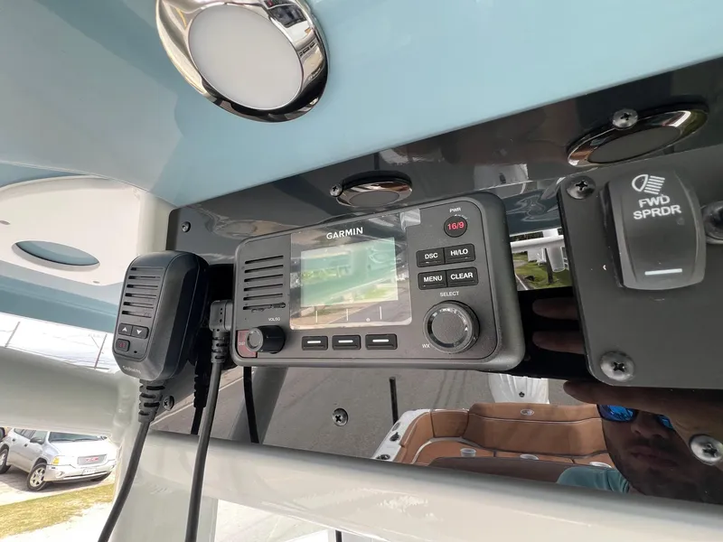 Slide: The Image of Garmin marine radio on 2025 Sea Hunt Ultra 235SE boat dashboard. - 19
