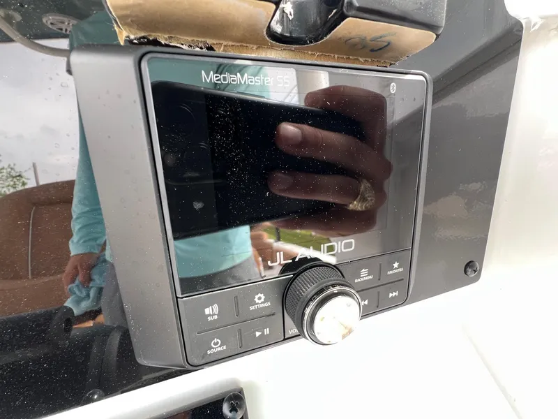 Slide: The Image of JL Audio MediaMaster system on 2025 Sea Hunt Ultra 235SE boat dashboard. - 20