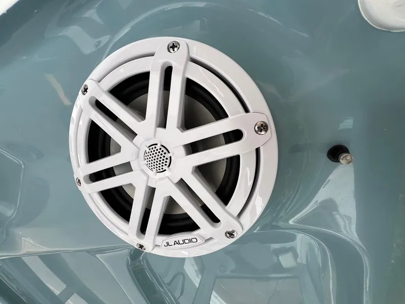 Slide: The Image of White JL Audio speaker on 2025 Sea Hunt Ultra 235SE boat. - 21