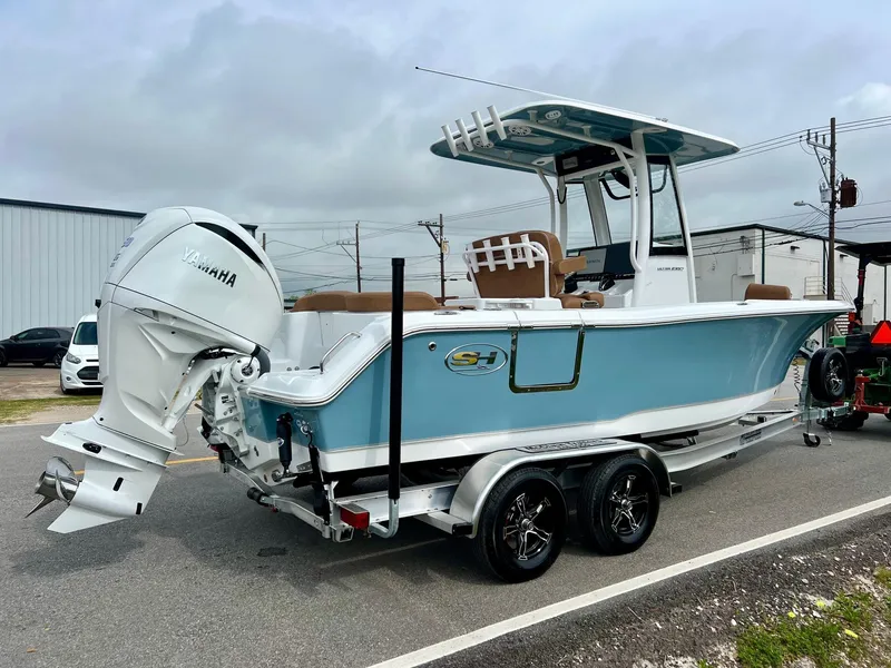 Slide: The Image of 2025 Sea Hunt Ultra 235SE boat with Yamaha engine on a trailer. - 4