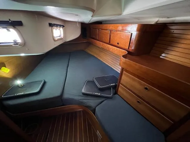 Slide: The Image of Cozy cabin interior of a 1996 Sabre 402 sailboat with wooden furnishings. - 21