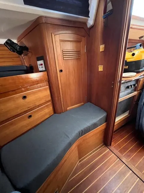 Slide: The Image of Interior of a 1996 Sabre 402 sailboat with wooden cabinetry and seating. - 22