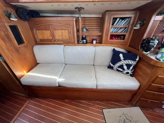 Slide: The Image of Interior of 1996 Sabre 402 yacht with cushioned seating and nautical decor. - 3
