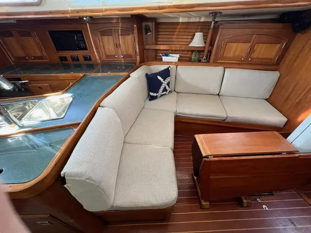 Slide: The Image of Spacious interior of 1996 Sabre 402 yacht with cozy seating and wooden cabinetry. - 4
