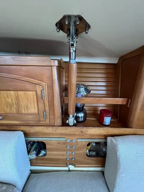 Slide: The Image of Interior of a 1996 Sabre 402 sailboat with wooden cabinetry and seating. - 6