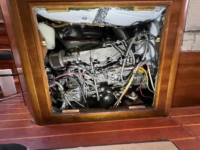 Slide: The Image of Engine compartment of a 1996 Sabre 402 sailboat, showcasing wiring and mechanical components. - 7