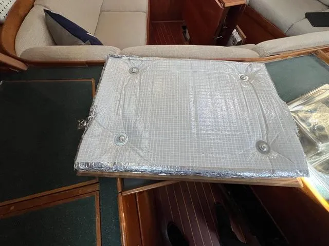 Slide: The Image of Interior of 1996 Sabre 402 yacht with insulated cover on table. - 9