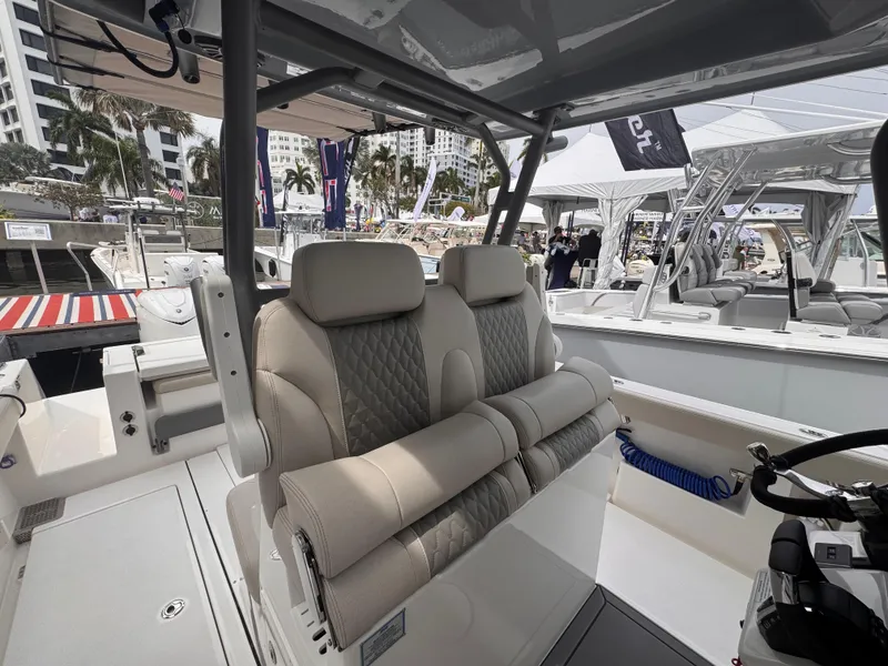 Slide: The Image of Luxurious seating on 2025 Solace 30 CS boat at a marina event. - 16
