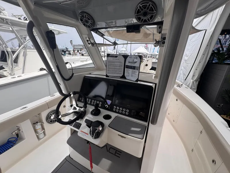 Slide: The Image of 2025 Solace 30 CS boat cockpit with modern controls and navigation equipment. - 18