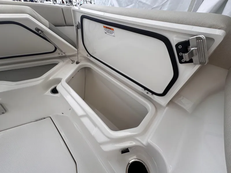 Slide: The Image of Open storage compartment on a 2025 Solace 30 CS boat, showcasing interior space. - 32
