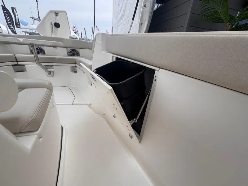 Slide: The Image of 2025 Solace 30 CS boat interior with storage compartment open. - 37