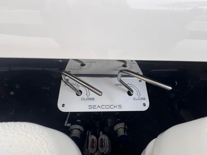 Slide: The Image of Seacock controls on a 2025 Solace 30 CS boat, showing open and close positions. - 4