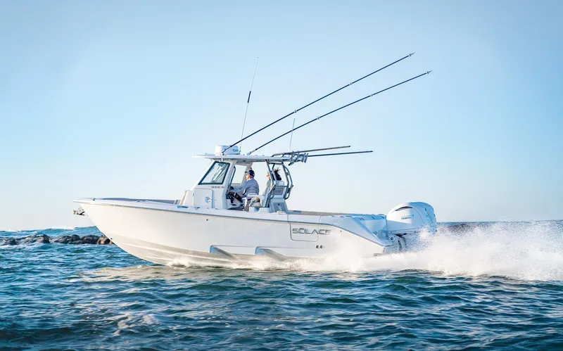 Slide: The Image of 2025 Solace 30 CS boat cruising on open water, showcasing sleek design and powerful performance. - 40