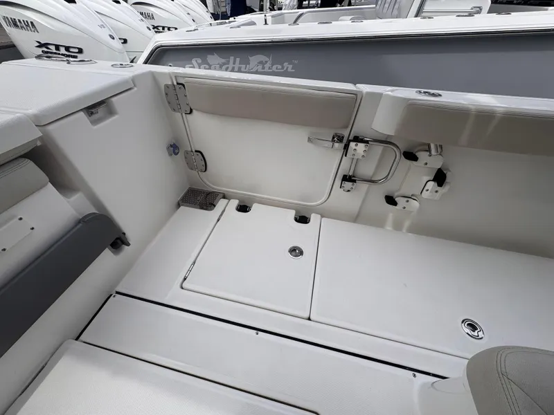 Slide: The Image of 2025 Solace 30 CS boat interior with storage compartments and seating. - 9