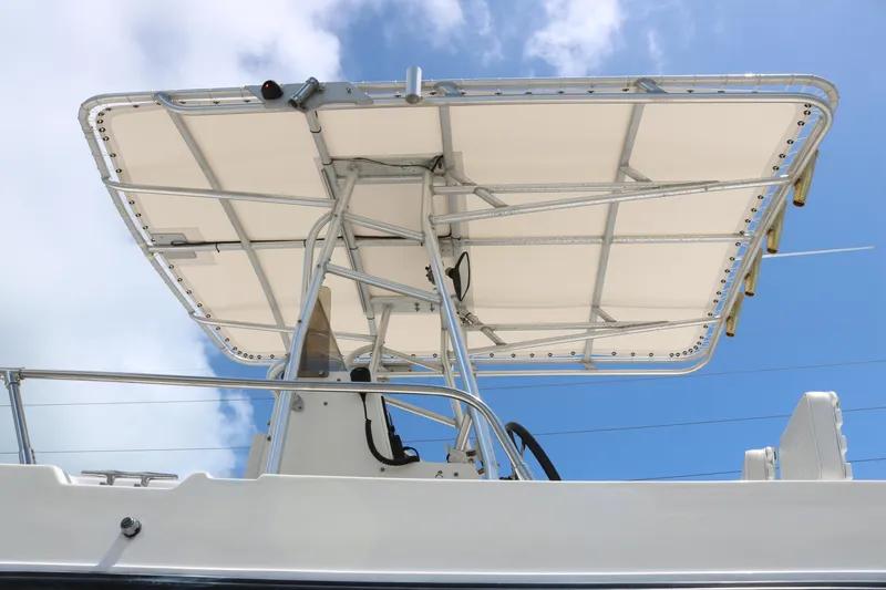 Slide: The Image of 1996 Sea Cat SL5 boat with canopy against blue sky. - 5
