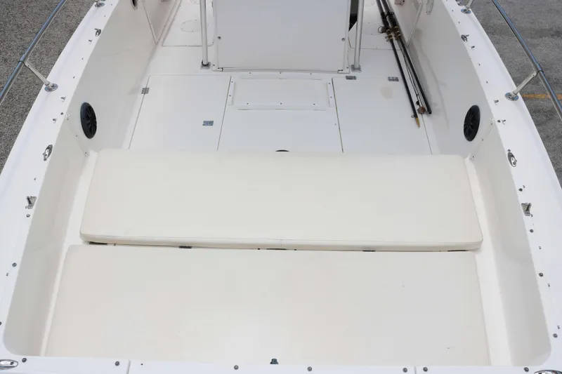 Slide: The Image of 1996 Sea Cat SL5 boat interior with white seating and storage compartments. - 9