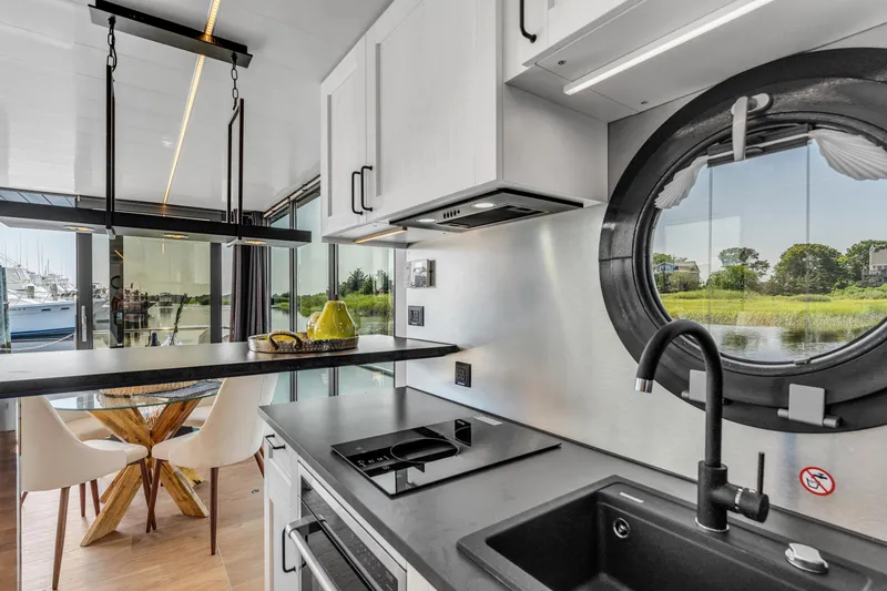 Slide: The Image of Modern kitchen interior in 2025 Waterlodge Apart XXL houseboat with scenic window view. - 19