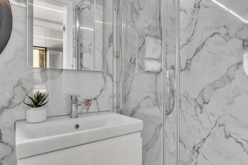 Slide: The Image of Modern bathroom with marble walls in Waterlodge Apart XXL, 2025 model. - 24