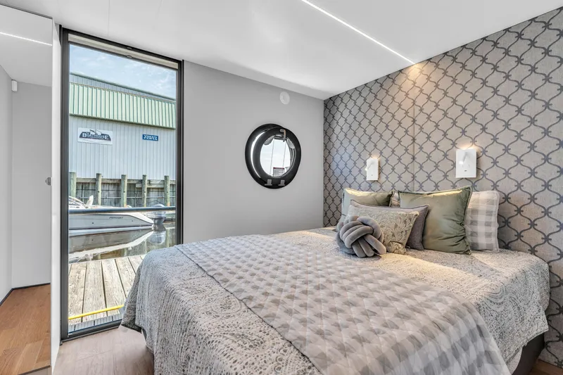 Slide: The Image of Modern bedroom in Waterlodge Apart XXL 2025, featuring elegant decor and waterfront view. - 25