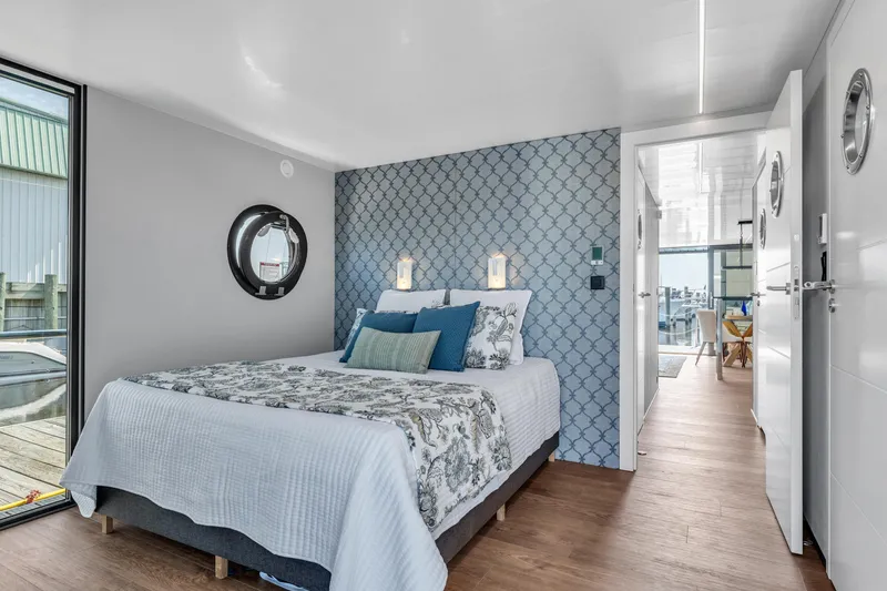 Slide: The Image of Modern bedroom in Waterlodge Apart XXL 2025, featuring nautical decor and elegant design. - 29