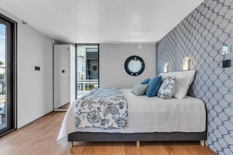 Slide: The Image of Modern bedroom in Waterlodge Apart XXL 2025, featuring stylish decor and patterned accent wall. - 33