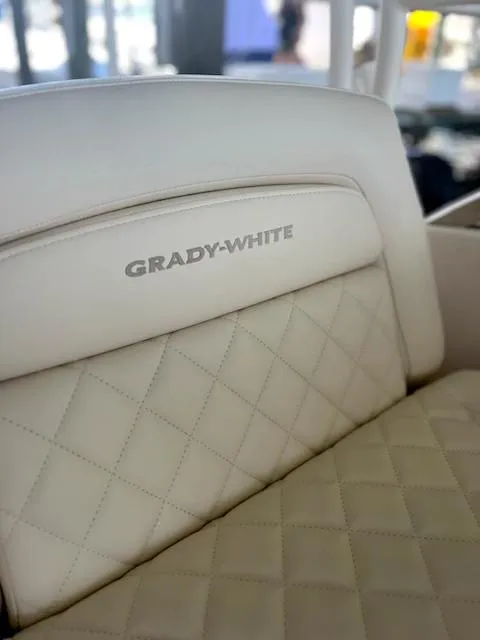 Slide: The Image of 2024 Grady-White Freedom 275 boat seat with quilted design and logo. - 4